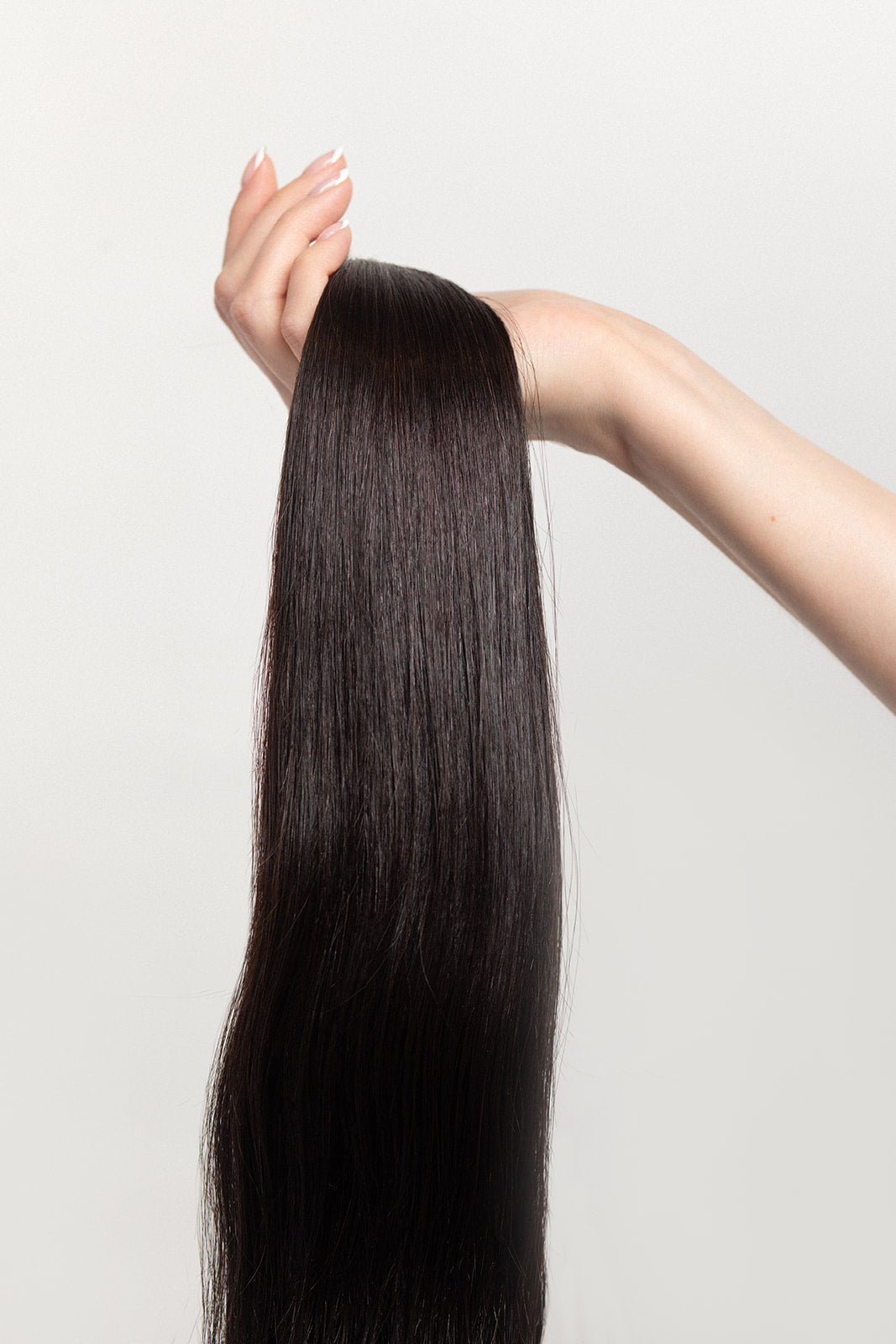Nightfall is our darkest brown with cool undertones. Envision indulging in a 90% Cocoa Dark Chocolate bar - with zero calories. Stylist lingo: Natural level 3/4 Harloc Tape-In Extensions are made from ethically sourced, premium, Remy Slavic Hair. These reusable hair extensions can be used to add length, volume, chemical-free colour, or to correct or enhance a haircut. Available in 16 beautiful shades. Combine multiple colours to create a custom colour blend and perfect match.