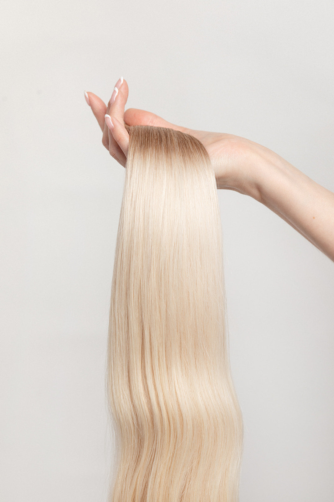Vetiver Vanilla is our icy blonde, blended out from a Sand root. Stylist lingo: Natural rooted level 8 blended into an icy level 10 Harloc Tape-In Extensions are made from ethically sourced, premium, Remy Slavic Hair. These reusable hair extensions can be used to add length, volume, chemical-free colour, or to correct or enhance a haircut. Available in 16 beautiful shades. Combine multiple colours to create a custom colour blend and perfect match.