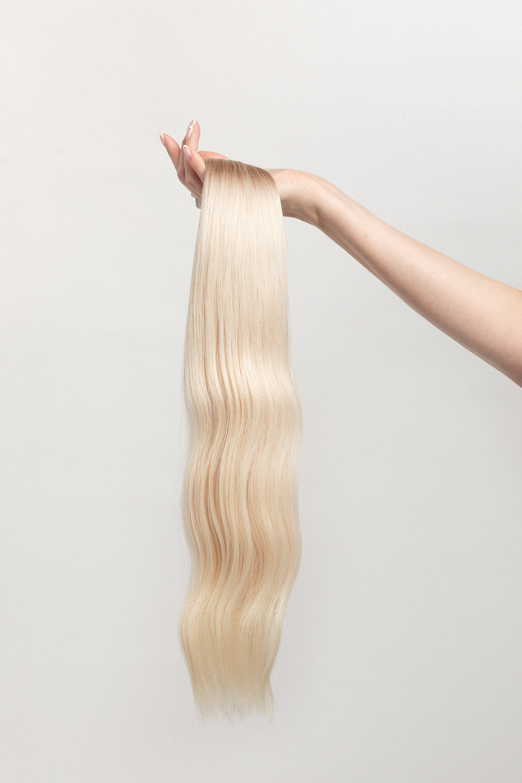 Vetiver Vanilla is our icy blonde, blended out from a Sand root. Stylist lingo: Natural rooted level 8 blended into an icy level 10 Harloc Tape-In Extensions are made from ethically sourced, premium, Remy Slavic Hair. These reusable hair extensions can be used to add length, volume, chemical-free colour, or to correct or enhance a haircut. Available in 16 beautiful shades. Combine multiple colours to create a custom colour blend and perfect match.