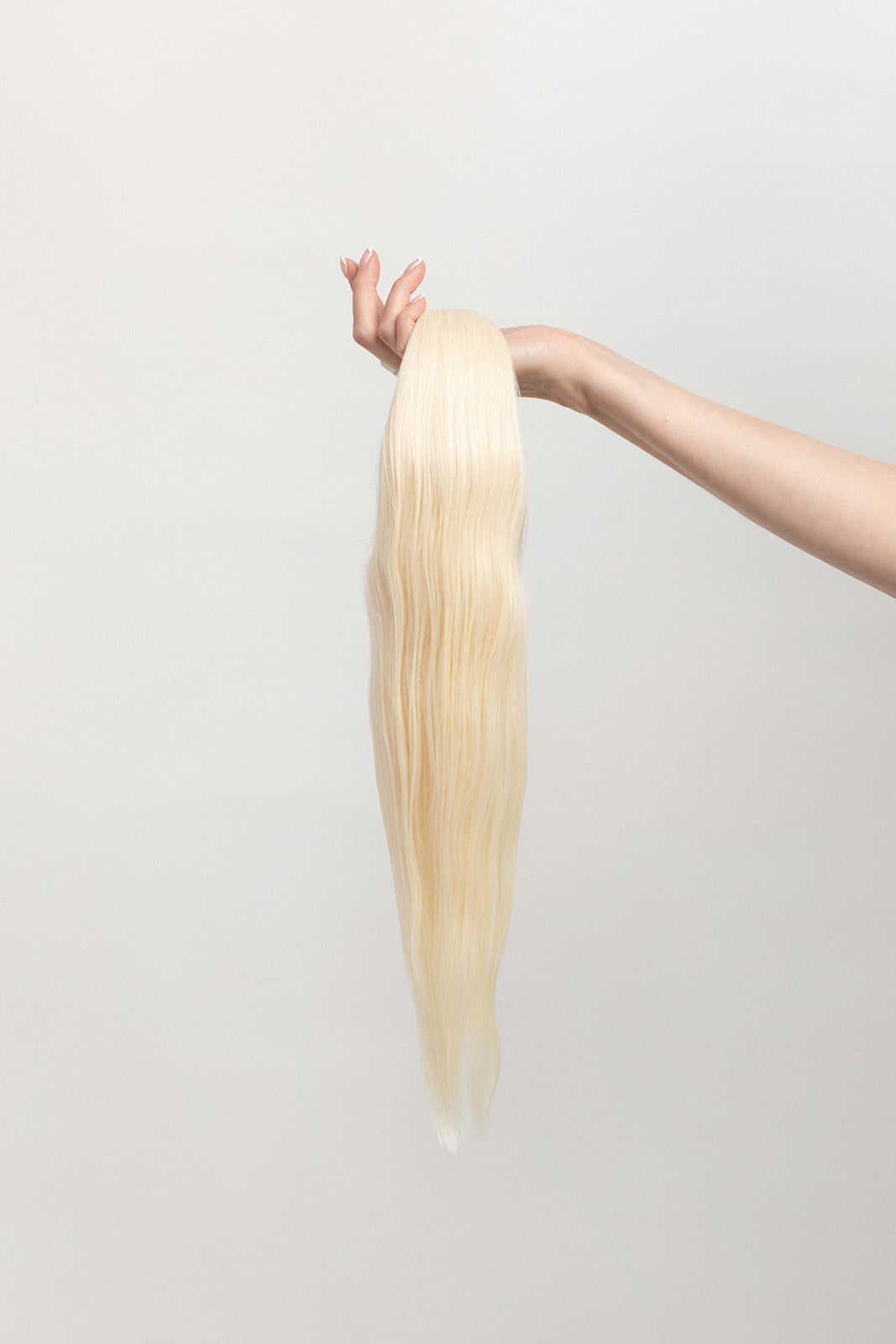 Moonstone is our lightest and brightest blonde with slight golden undertones. C'mon Barbie, let's go party! Stylist lingo: Natural level 10 Harloc Tape-In Extensions are made from ethically sourced, premium, Remy Slavic Hair. These reusable hair extensions can be used to add length, volume, chemical-free colour, or to correct or enhance a haircut. Available in 16 beautiful shades. Combine multiple colours to create a custom colour blend and perfect match.