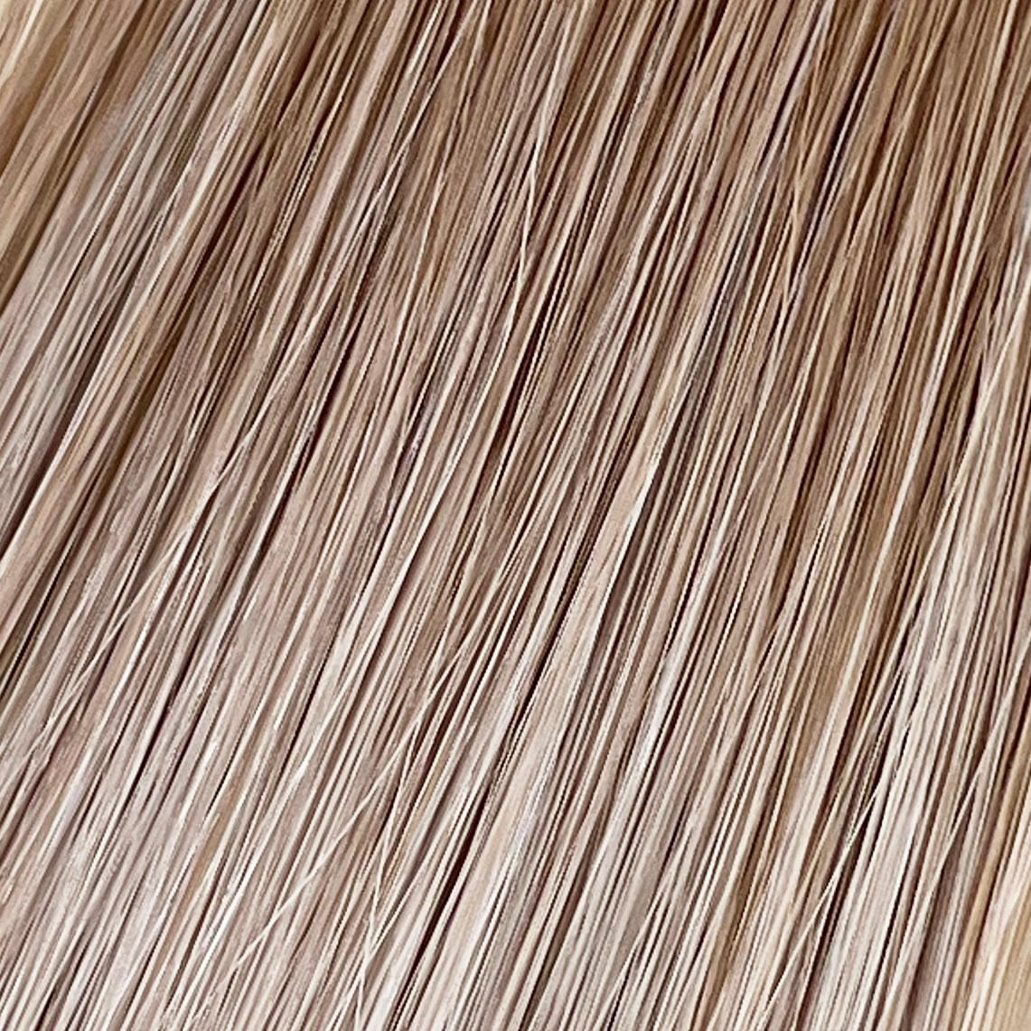 Soleil Sand is our golden blonde blend cascading from a Sand root.Stylist lingo: Natural rooted level 8 blended into natural/gold dimensional levels 8 & 10 Harloc Tape-In Extensions are made from ethically sourced, premium, Remy Slavic Hair. These reusable hair extensions can be used to add length, volume, chemical-free colour, or to correct or enhance a haircut. Available in 16 beautiful shades. Combine multiple colours to create a custom colour blend and perfect match.
