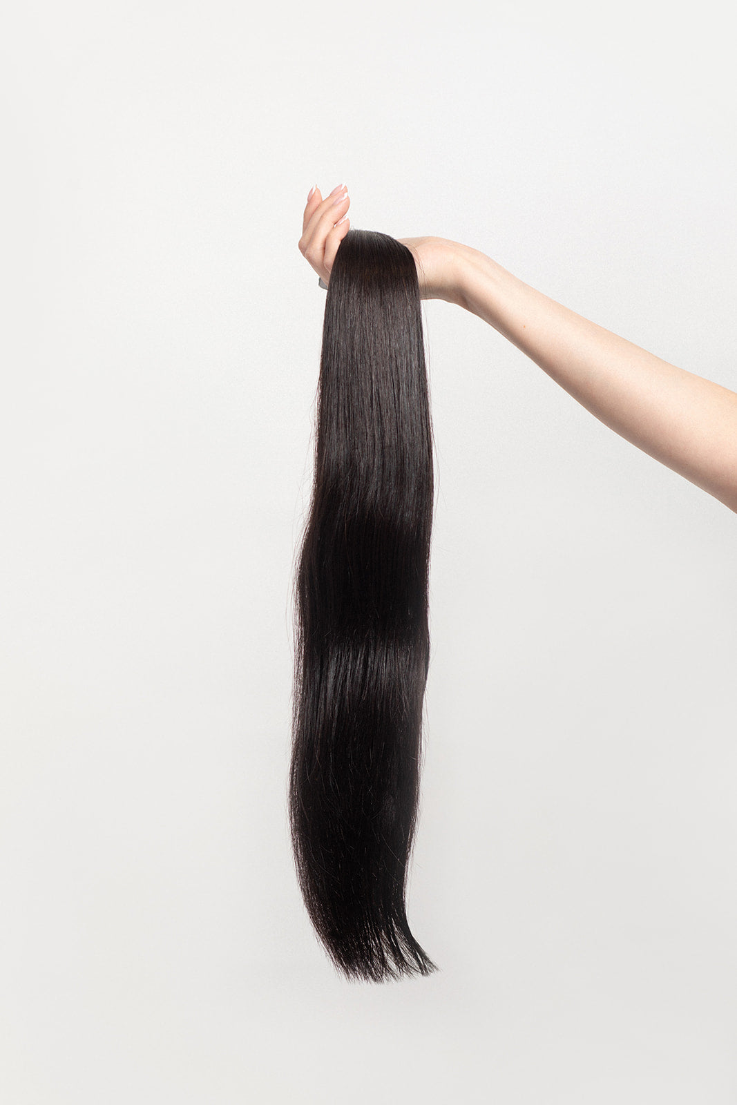 Nightfall is our darkest brown with cool undertones.  Stylist lingo: Natural level 3/4 Hidden Harloc Clip-In Extensions are made from ethically sourced, Remy Slavic hair. They come with 5 seamless silicone wefts to ensure an undetectable result that is comfortable to wear. Whether you are looking to add volume or length, a stunning look for a special event, or just want to look and feel gorgeous. Available in 10 of our beautiful shades.