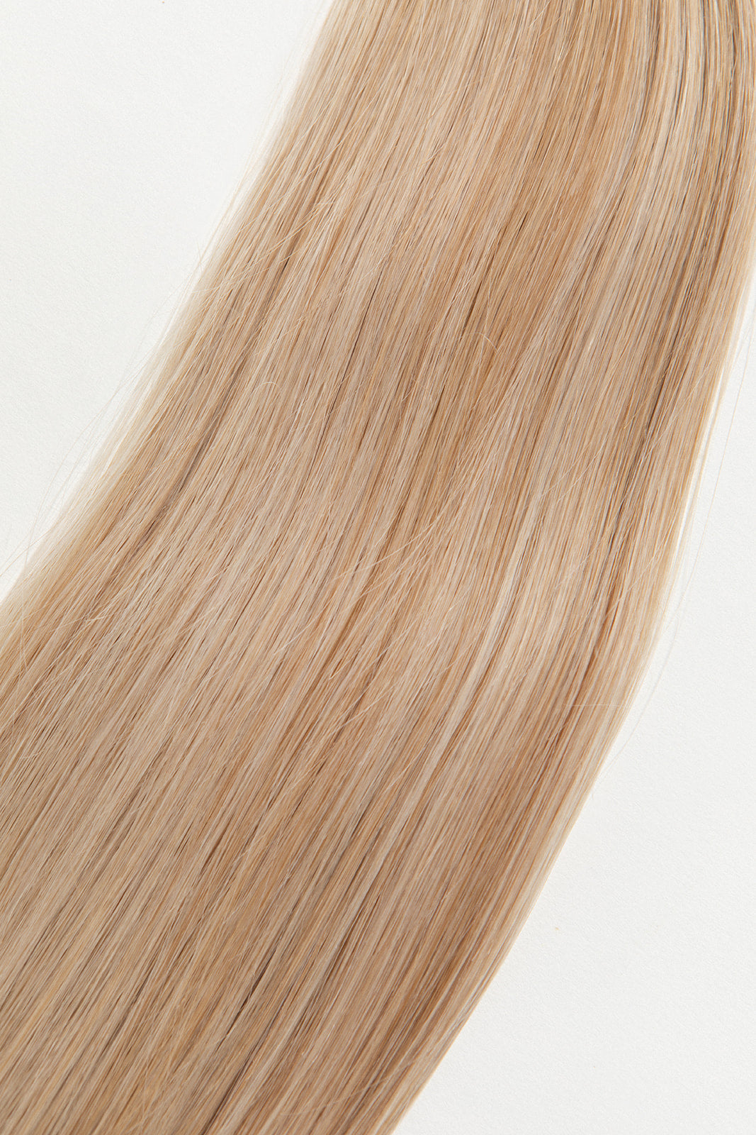 Honey is our dimensional blonde with warm undertones. This will have you feeling sweet like honey but stinging like a bee. Stylist lingo: Natural/gold dimensional mix of levels 9 & 10 Harloc Tape-In Extensions are made from ethically sourced, premium, Remy Slavic Hair. These reusable hair extensions can be used to add length, volume, chemical-free colour, or to correct or enhance a haircut. Available in 16 beautiful shades. Combine multiple colours to create a custom colour blend and perfect match.