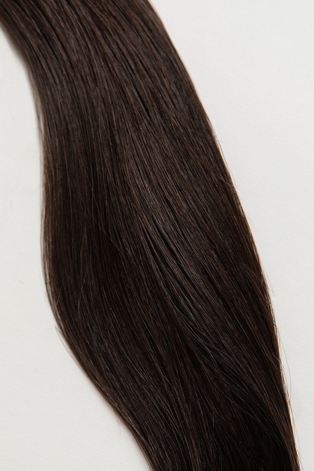 Shade is our dark brown with cool and warm undertones. Order it like you do your morning espresso: straight up, no dairy.  Stylist lingo: Natural level 5 Harloc Tape-In Extensions are made from ethically sourced, premium, Remy Slavic Hair. These reusable hair extensions can be used to add length, volume, chemical-free colour, or to correct or enhance a haircut. Available in 16 beautiful shades. Combine multiple colours to create a custom colour blend and perfect match.